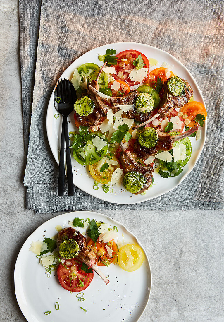 Lamb chops with herb butter and tomatoes