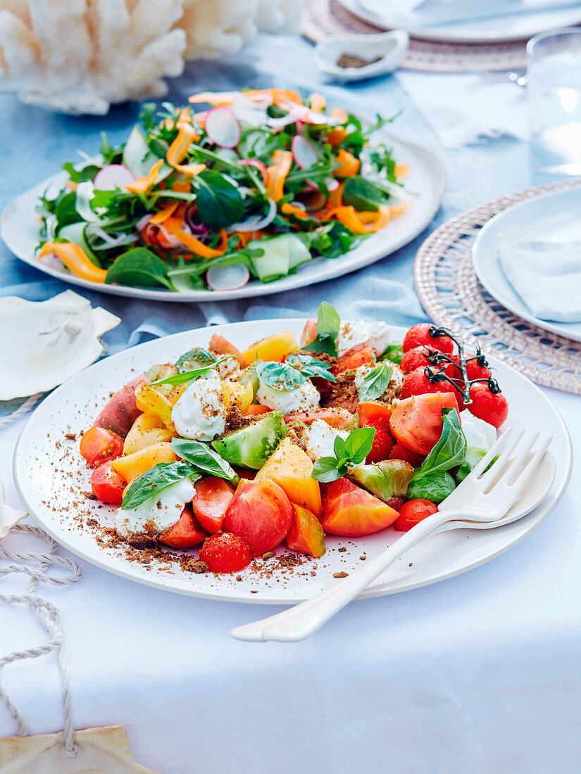 Heirloom tomato, basil and sheep's yoghurt salad and Qualia garden salad