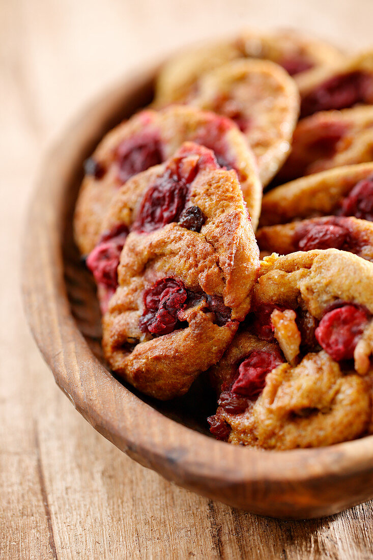 Cherry cookies in a wooden bowl