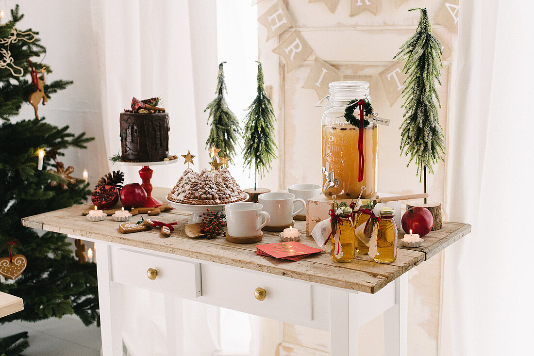 Hot apple punch, bundt cake and drip cake on dessert buffet