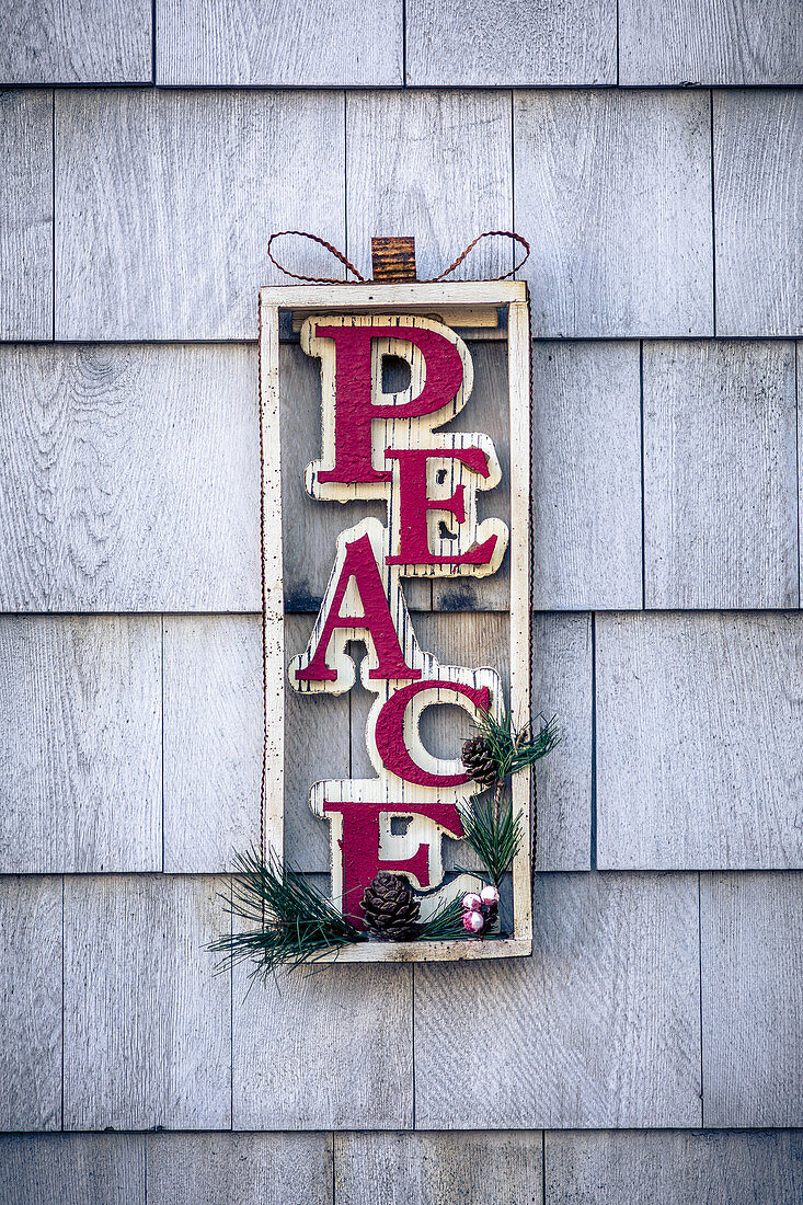 Christmas wall decoration with lettering spelling 'Peace'