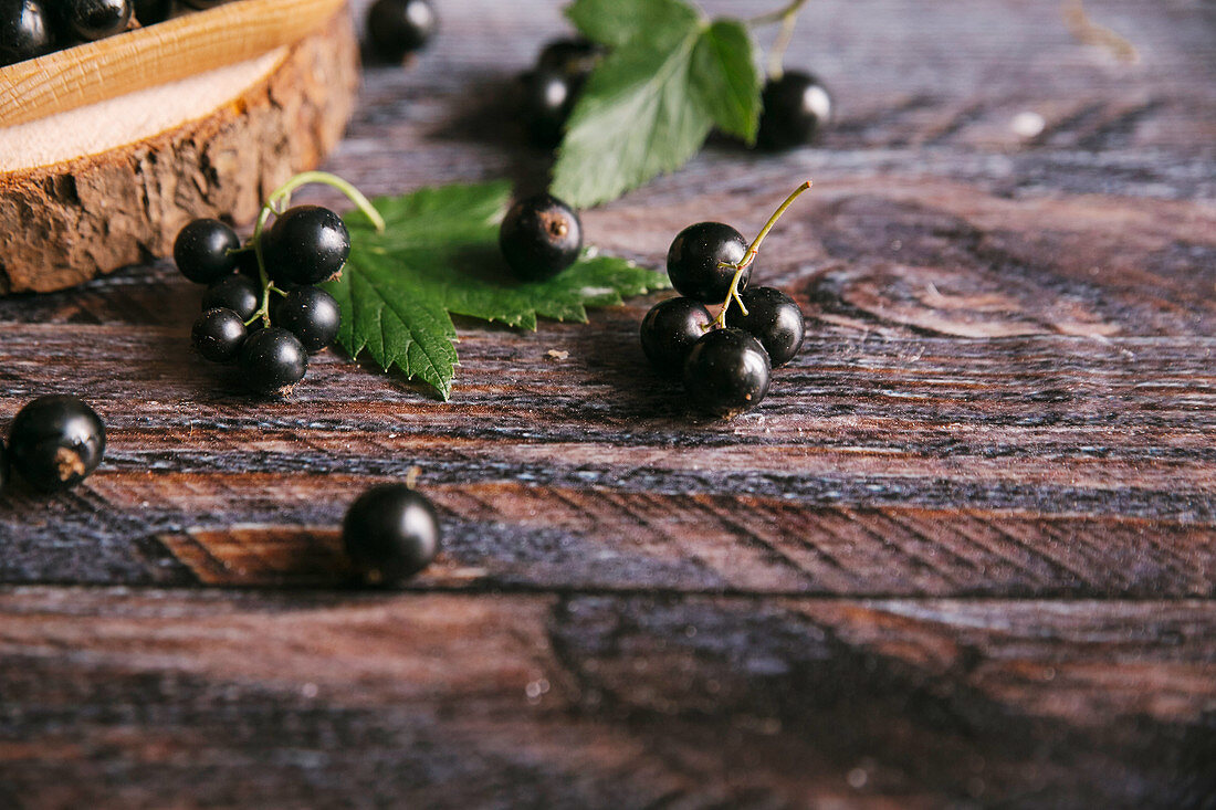 Blackcurrants on a wooden surface