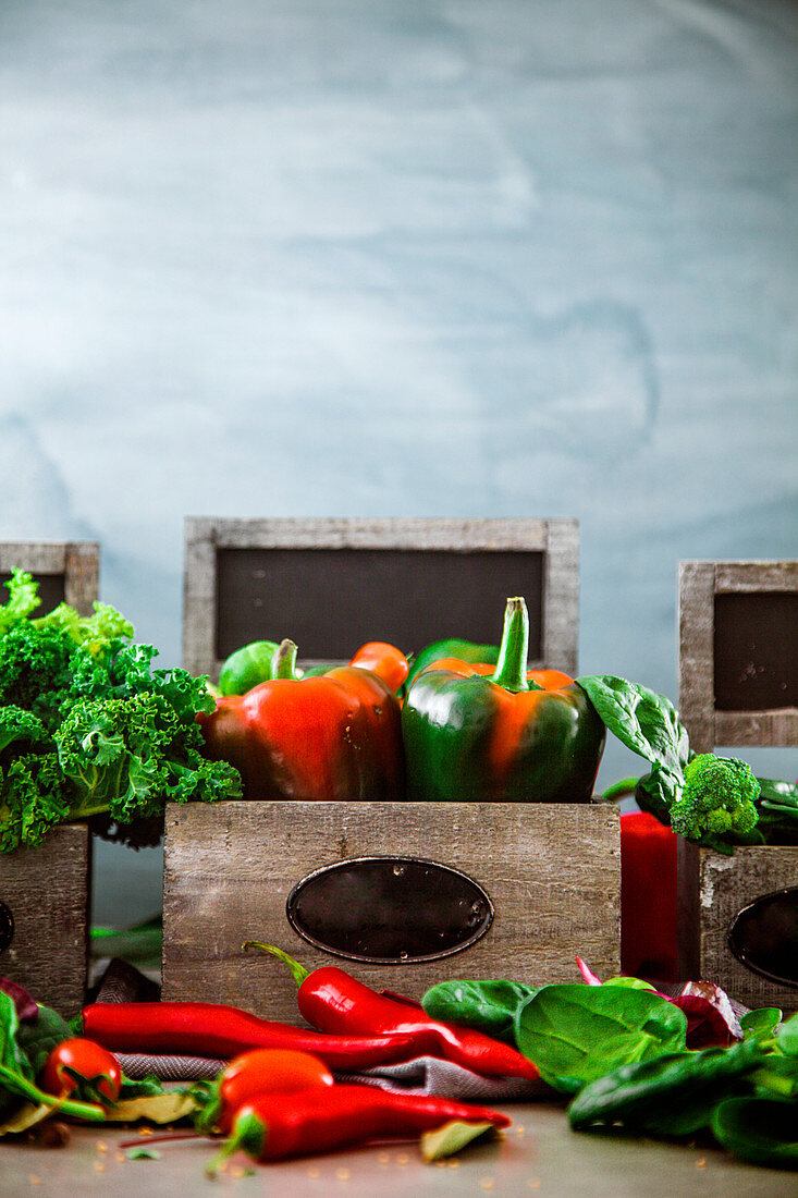 An arrangement of fresh vegetables in wooden boxes