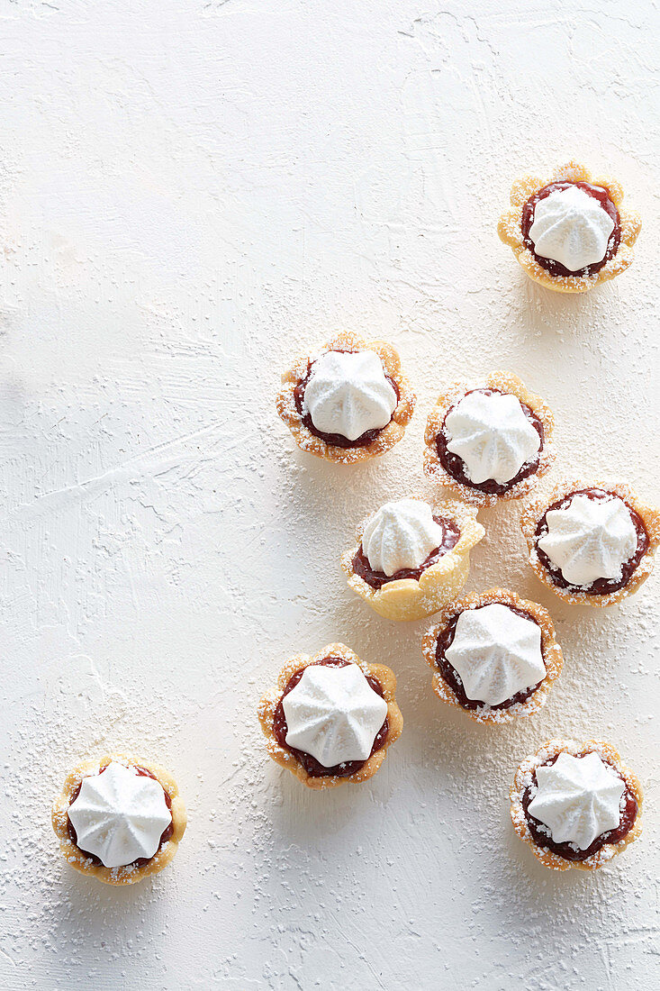 Almond and raspberry meringue tarts