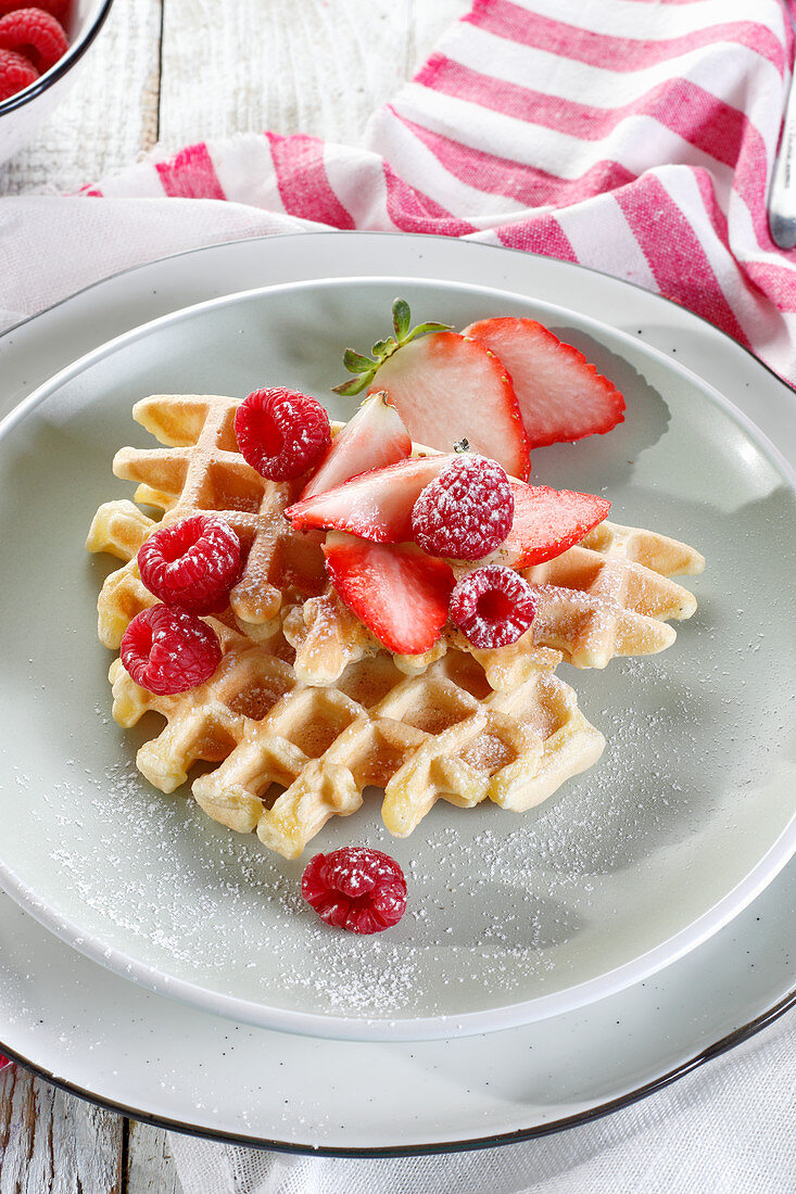 Waffles with raspberries and strawberries
