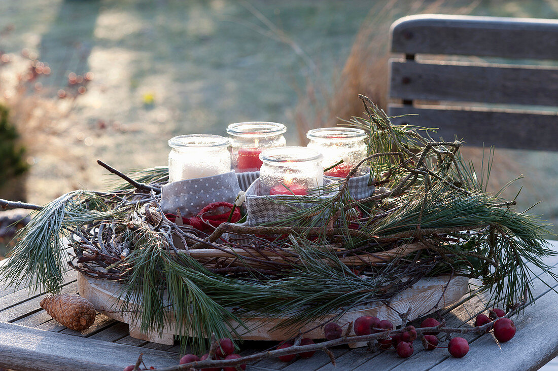 Advent wreath with preserving jars in hoarfrost