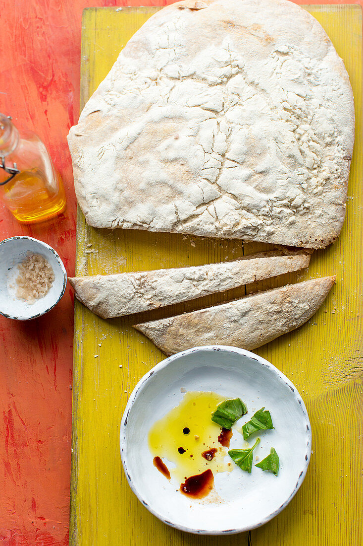 Soda bread and a small bowl of olive oil, balsamic vinegar and basil