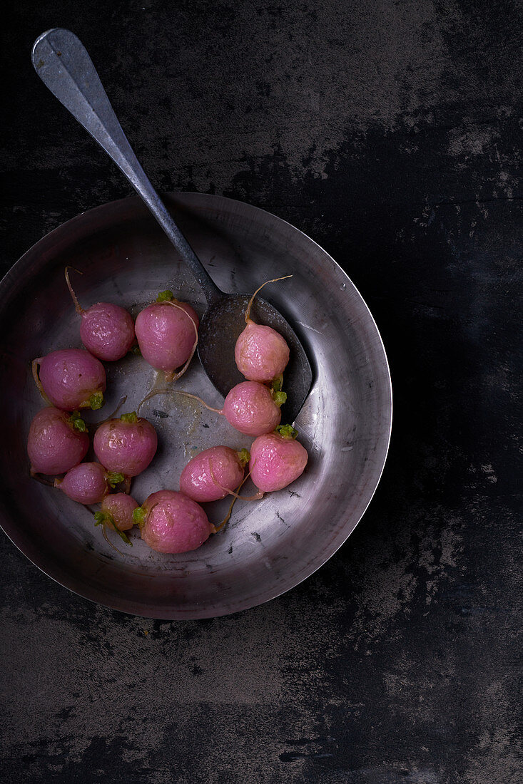 Glazed radishes in bowl