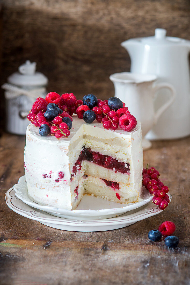 Angel food cake with berry jelly and buttercream
