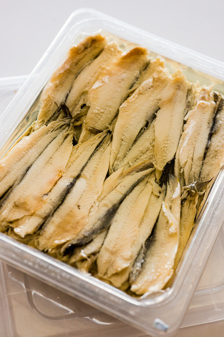 Anchovies in a plastic box