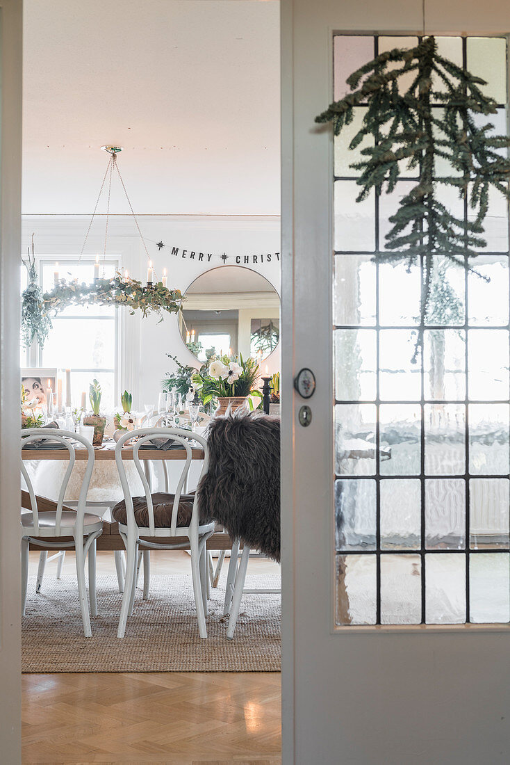 View through lattice doors into festively decorated dining room