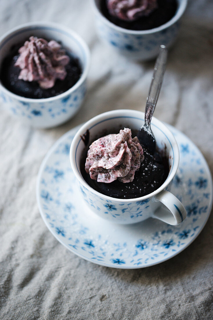 Vegan chocolate mug cake with raspberry chia cream