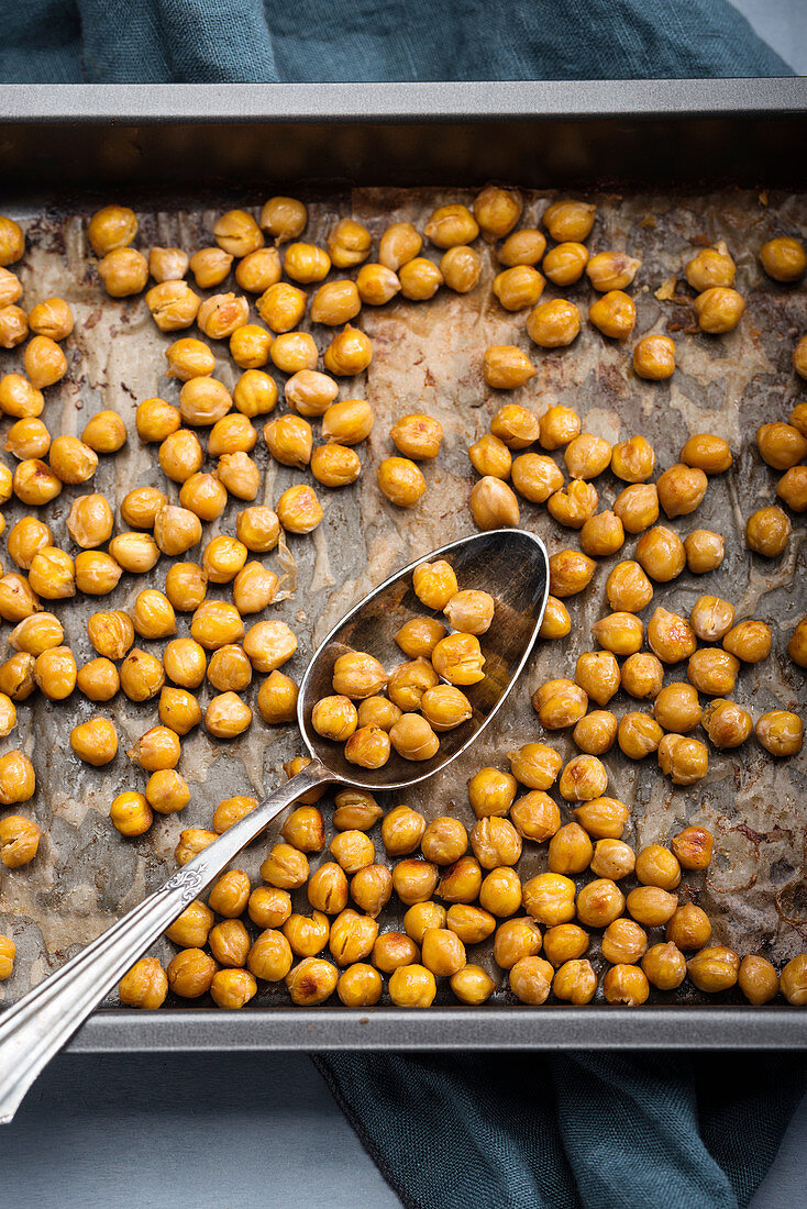 Spicy roasted chickpeas on a baking tray
