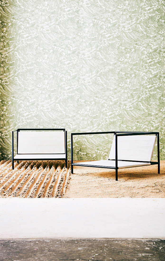 Outdoor chairs in front of wallpapered wall