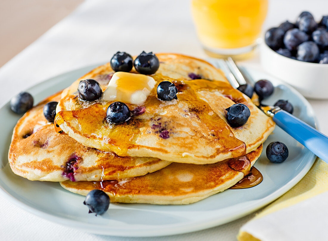 Pancakes with blueberries, butter and syrup