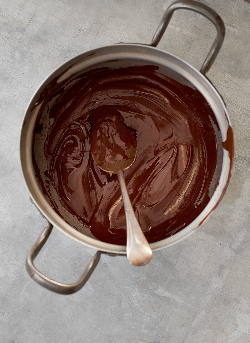 Melted chocolate couverture in a pot (top view)