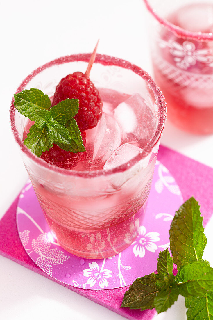 A raspberry and prosecco cocktail with mint