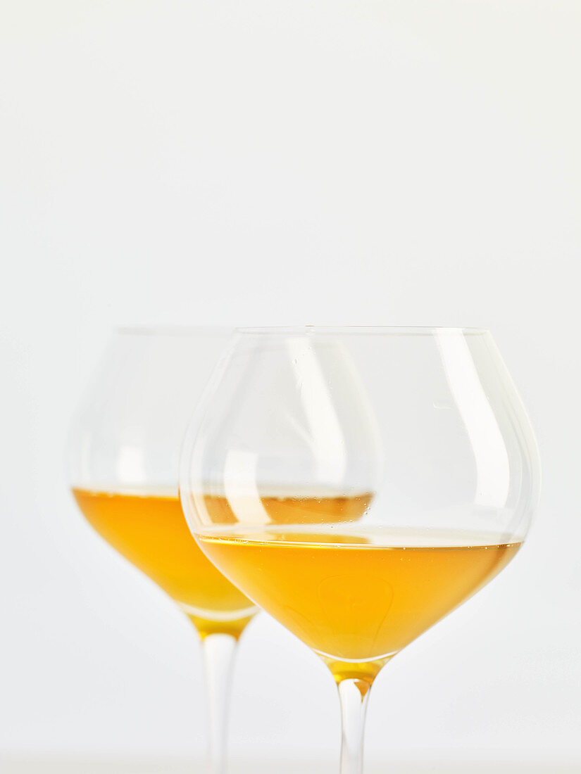Two glasses of natural wine (orange wine)