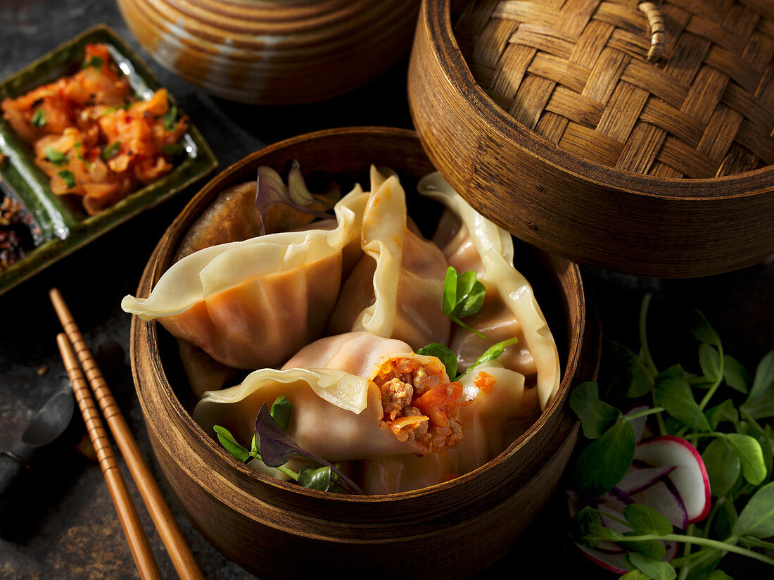 Asian dumplings in a bamboo basket