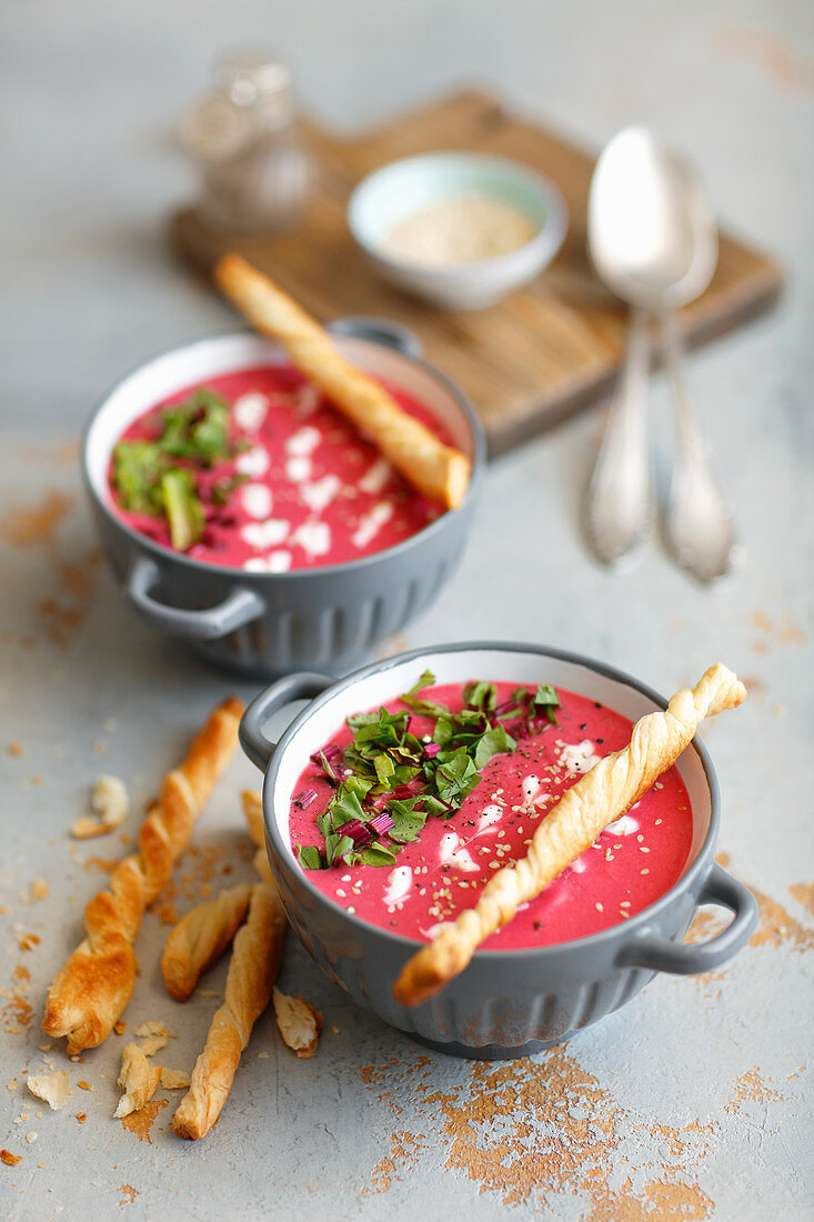 Young beetroot cream soup with puff pastry sticks