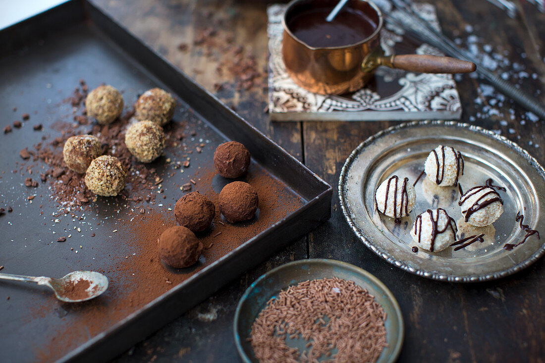 Handmade truffle pralines with chocolate sauce