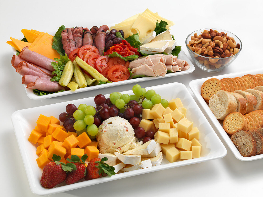 Various savory and sweet snacks on platters