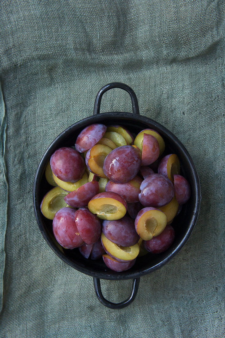 Halved and pitted plums