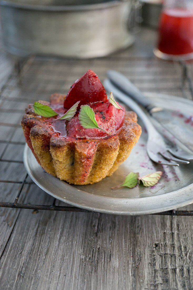 A cake with port wine plums and meadowsweet