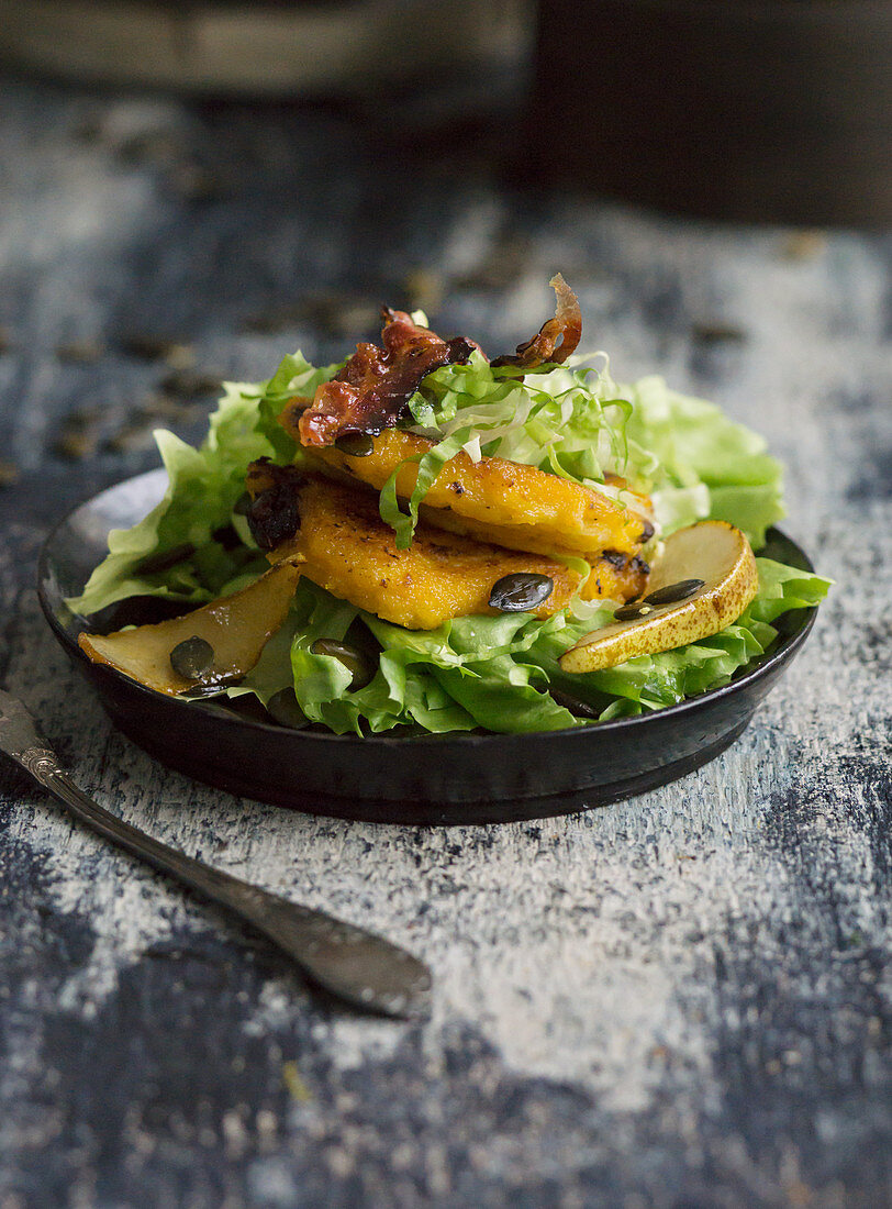 Beer battered pumpkin with endive and bacon salad