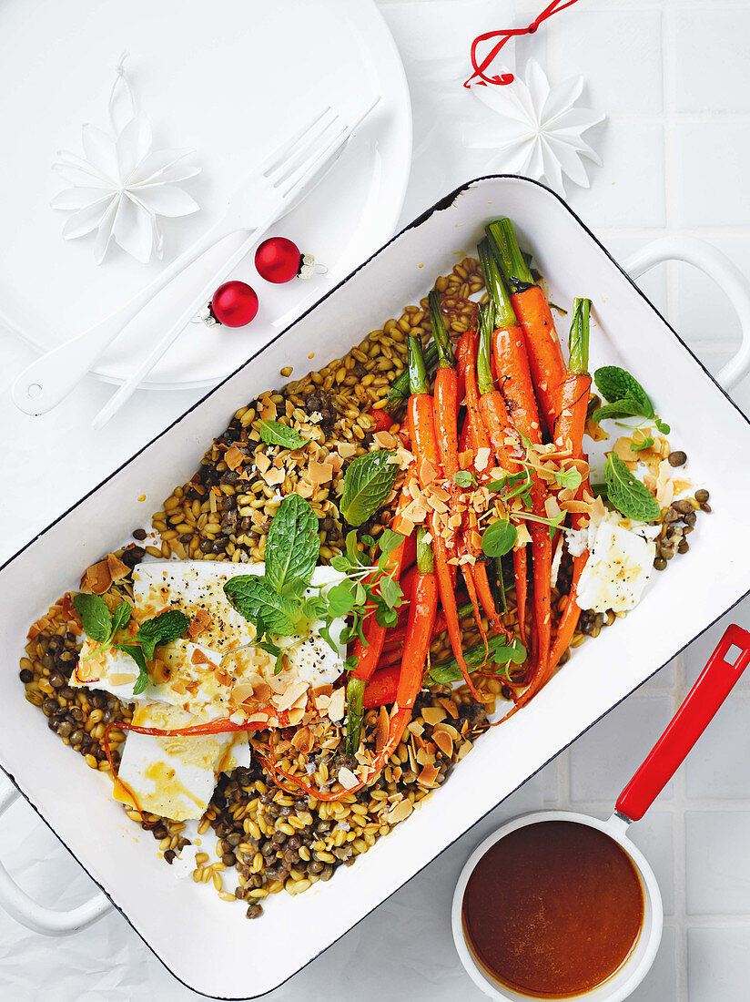 Honey-glazed carrots with feta cheese on a spelt and lentil medley