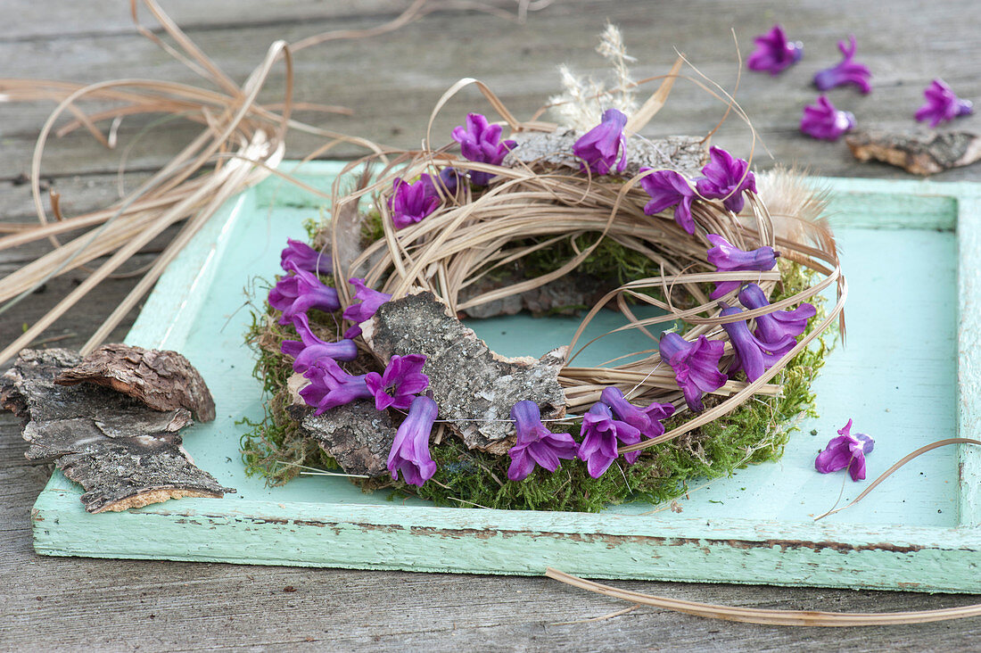 Wreath Of Moss, Grass And Bark With Flower Garland
