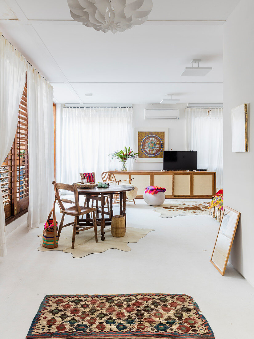 Ethnic-style artist's apartment with white floor