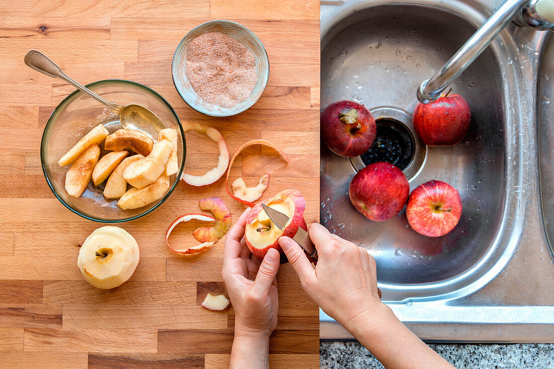 Hands peeling an apple.Preapring an apple tart