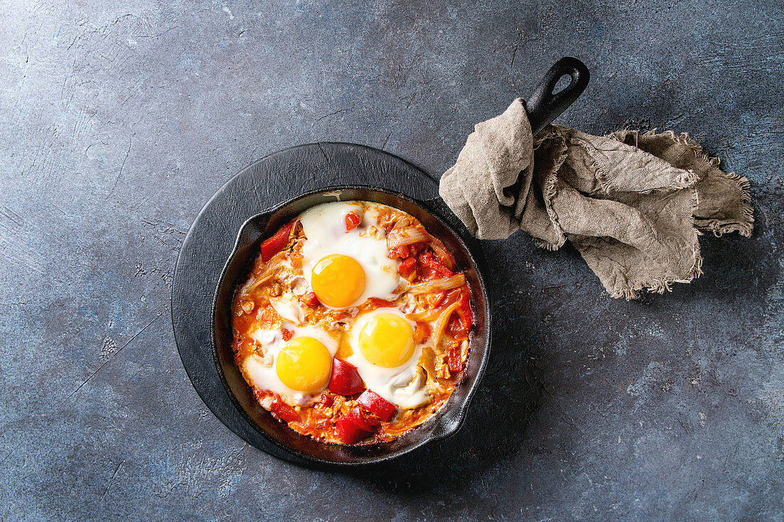 Traditional Israeli Cuisine dishes Shakshuka (Fried egg with vegetables tomatoes and paprika)