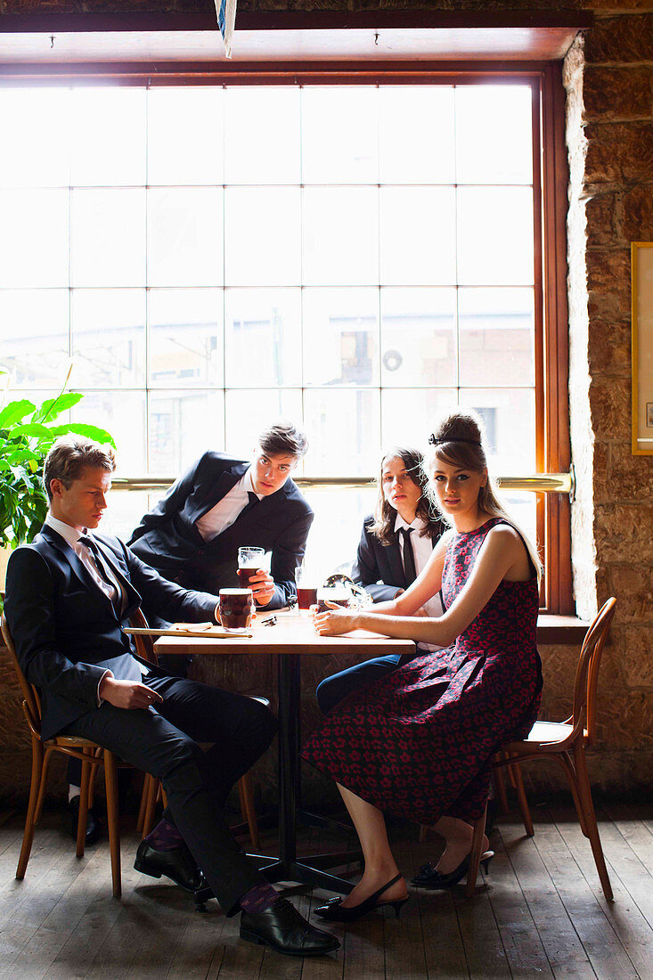 Elegantly dressed young people in a restaurant