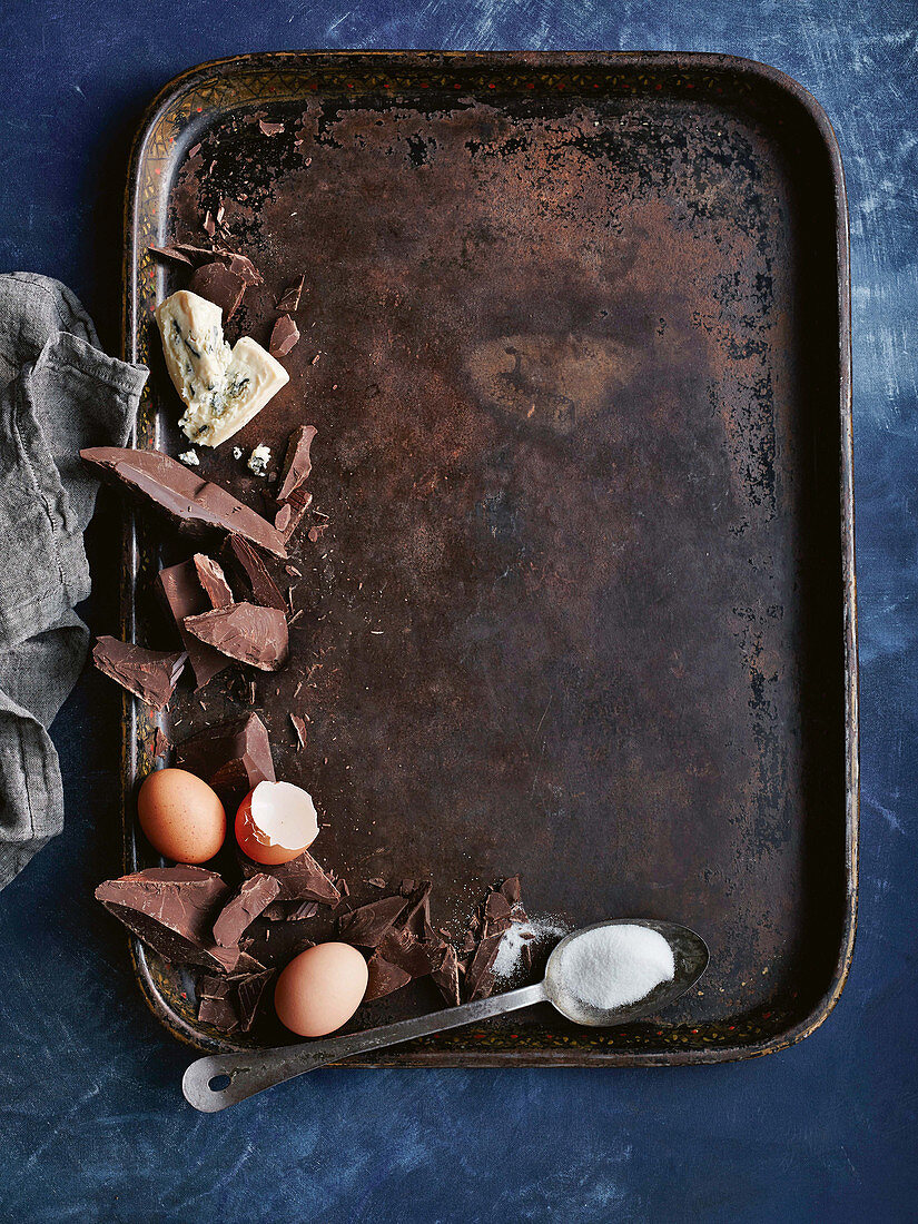 Ingredients for flourless chocolate cake with blue cheese on a baking tray
