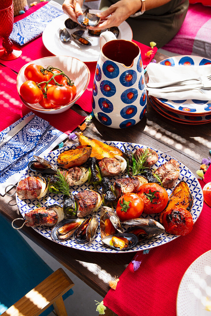 Grilled pork, mussels and vegetables