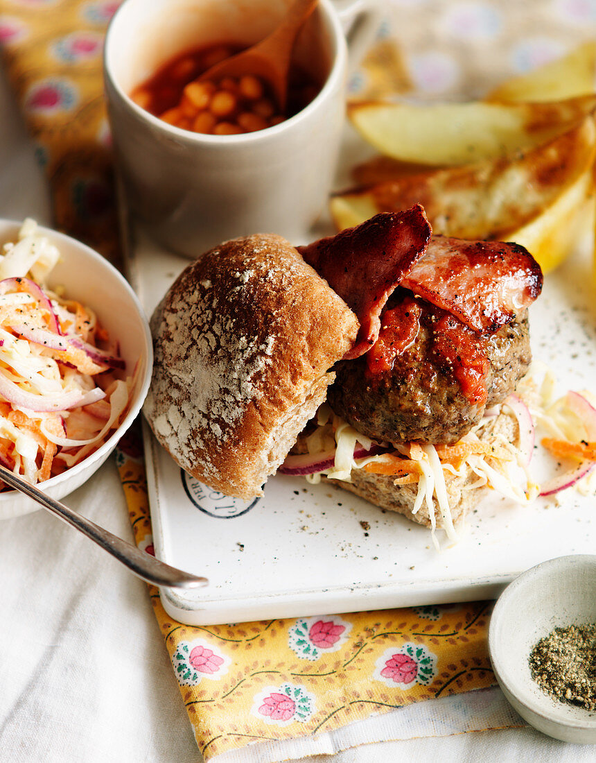 Burgers with bacon, baked beans and coleslaw