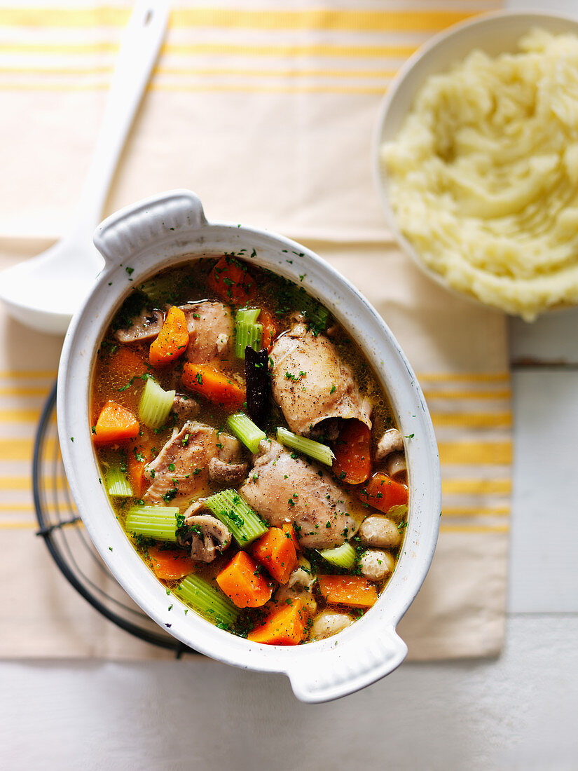Chicken stew with celery, carrots, leeks, mushrooms and mashed potato