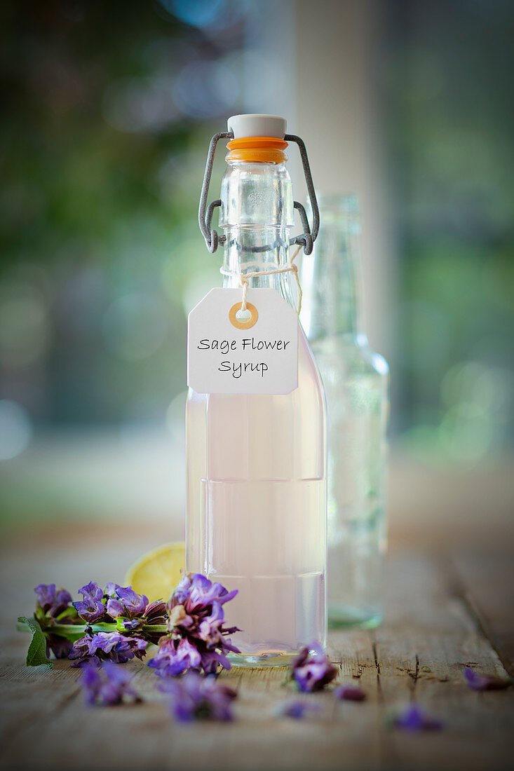 Sage flower syrup in a flip-top bottle
