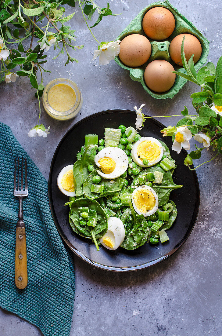 Baby spinach, celery and pea salad with egg dressing