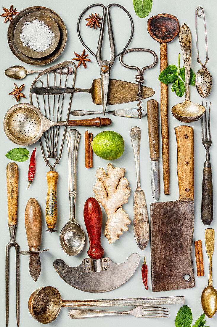 Collection of old vintage cutlery on grey background