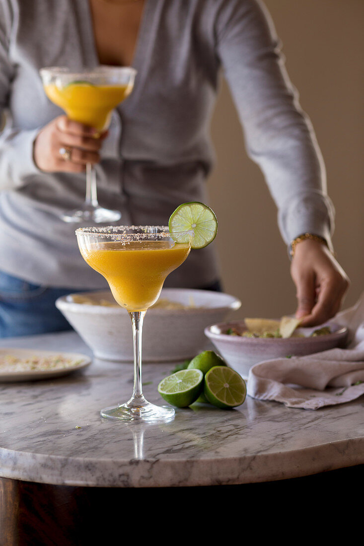 Mango Margarita with dips on a table