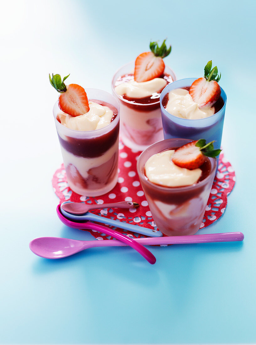 Custard with strawberries in glasses