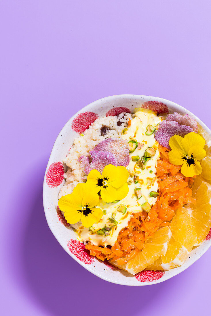 Bollywood saffron bowl with sweet carrots, couscous and oranges