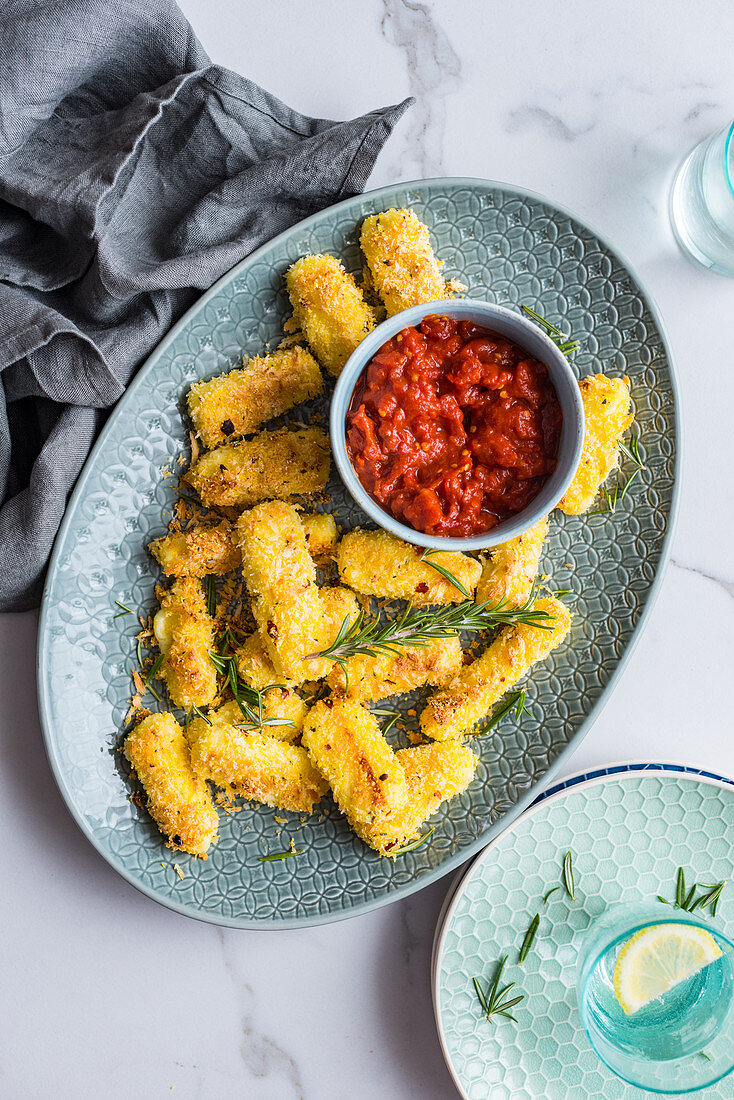 Halloumi sticks with polenta cake and tomato sauce