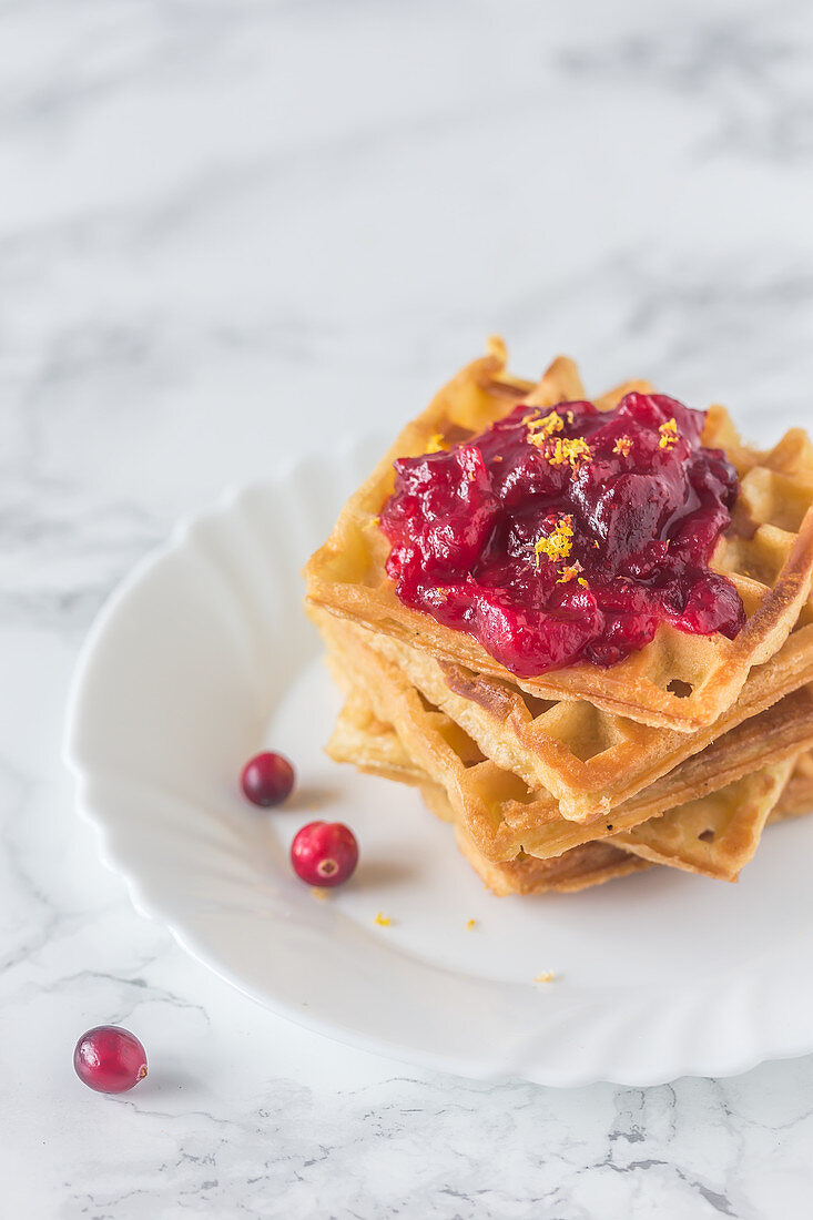 Stack of waffles with cranberry jam
