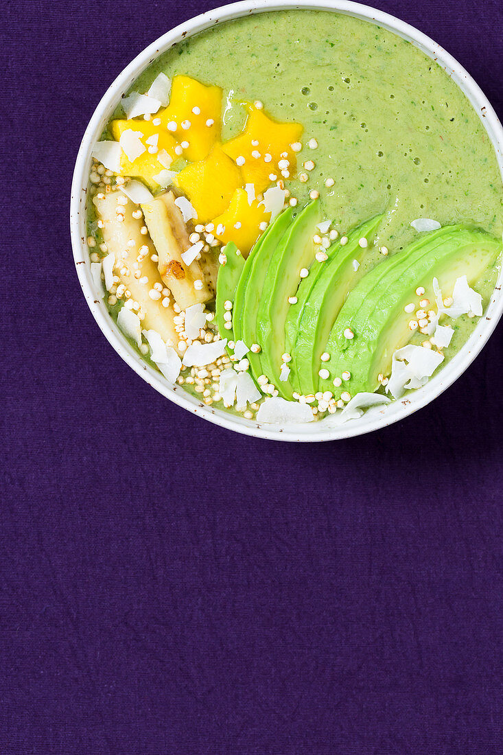 A matcha smoothie bowl with avocado and roasted bananas