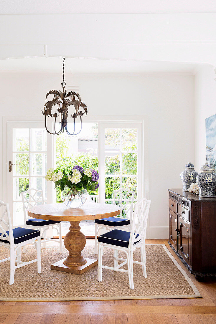 Baluster table in front of the patio door in the classic dining room