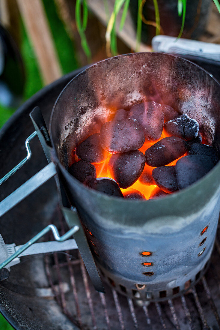 Glowing coals in a chimney starter